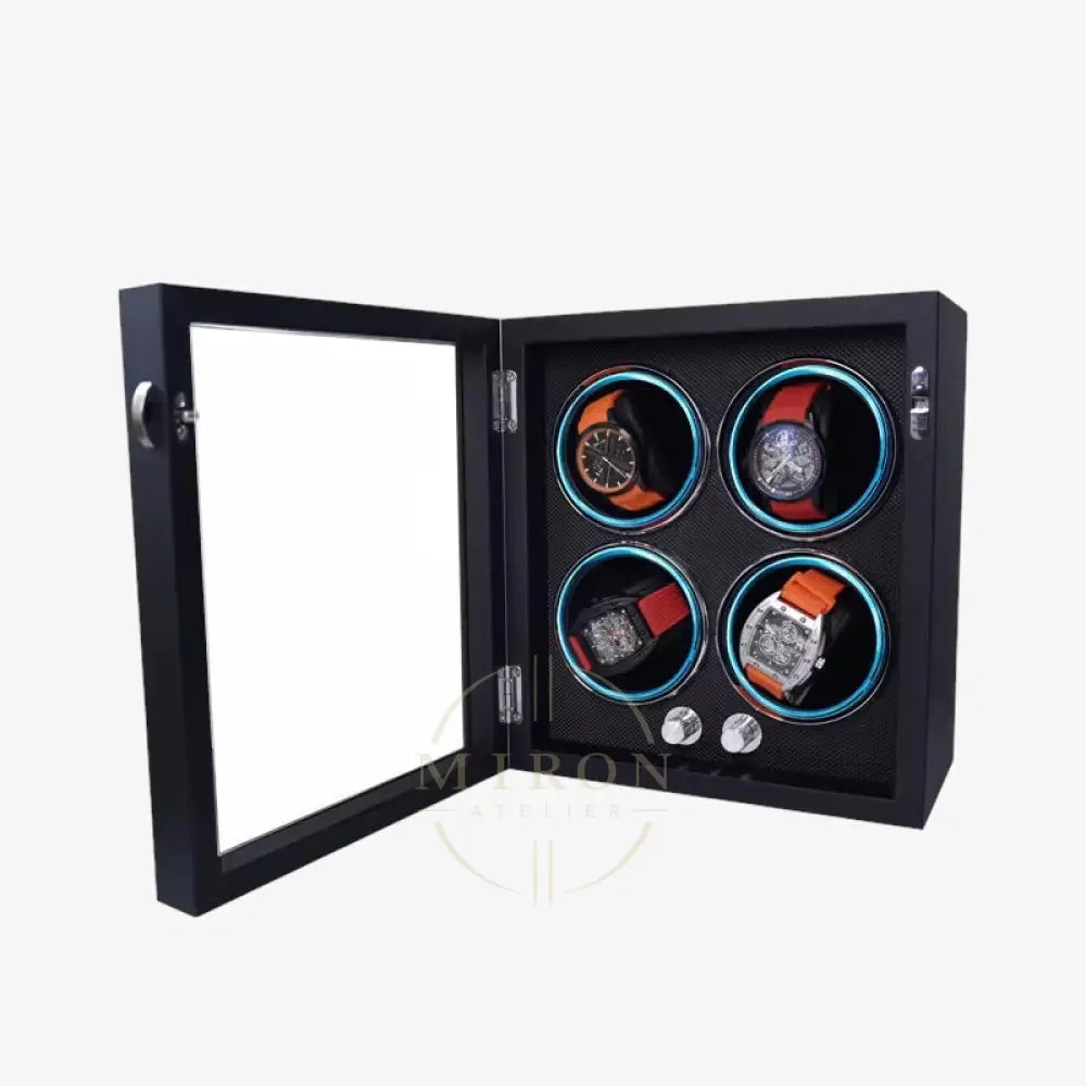 Black watch display case with four watches inside on a white background