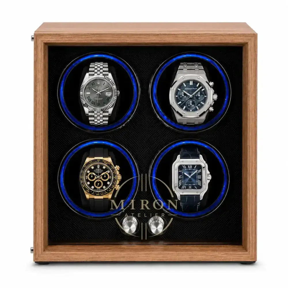 A wooden watch winder box with a warm brown wood-grain finish, featuring four circular watch positions illuminated by blue LED rings, shown on a clean white background.