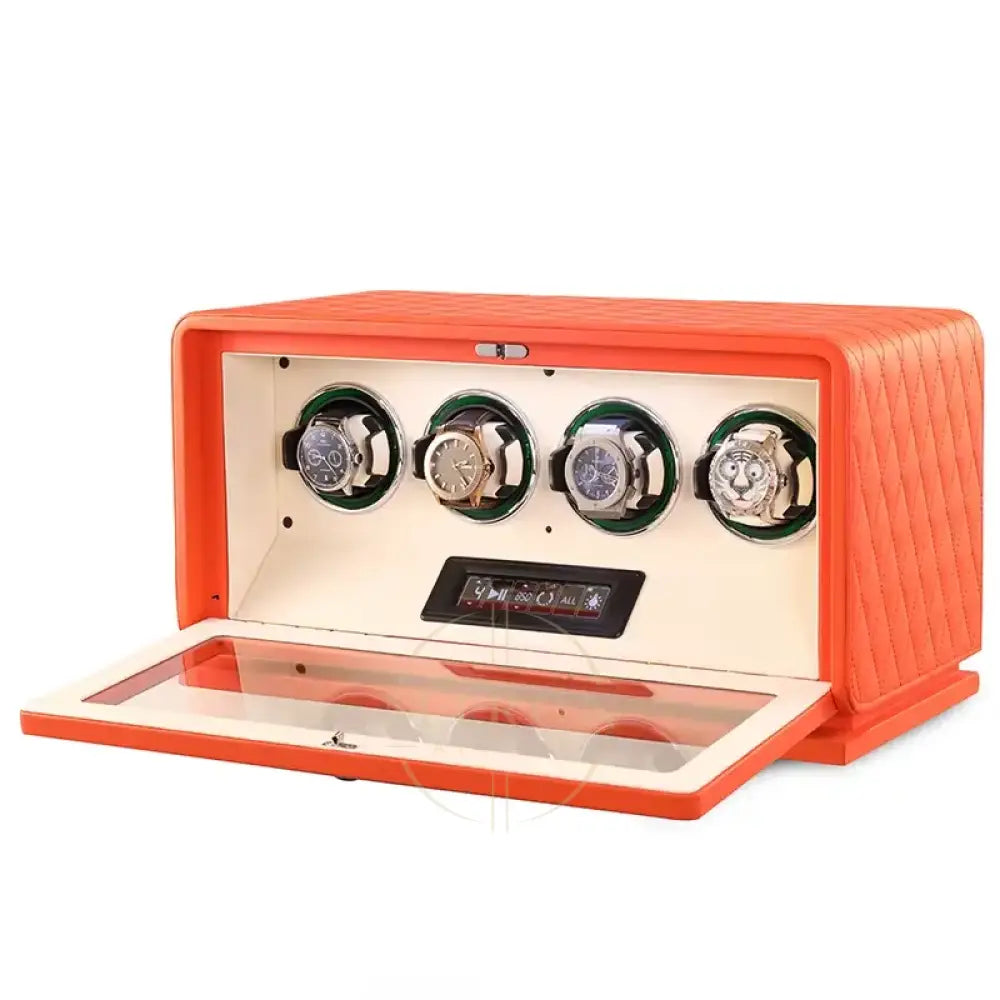 Orange watch winder with four watches on a white background
