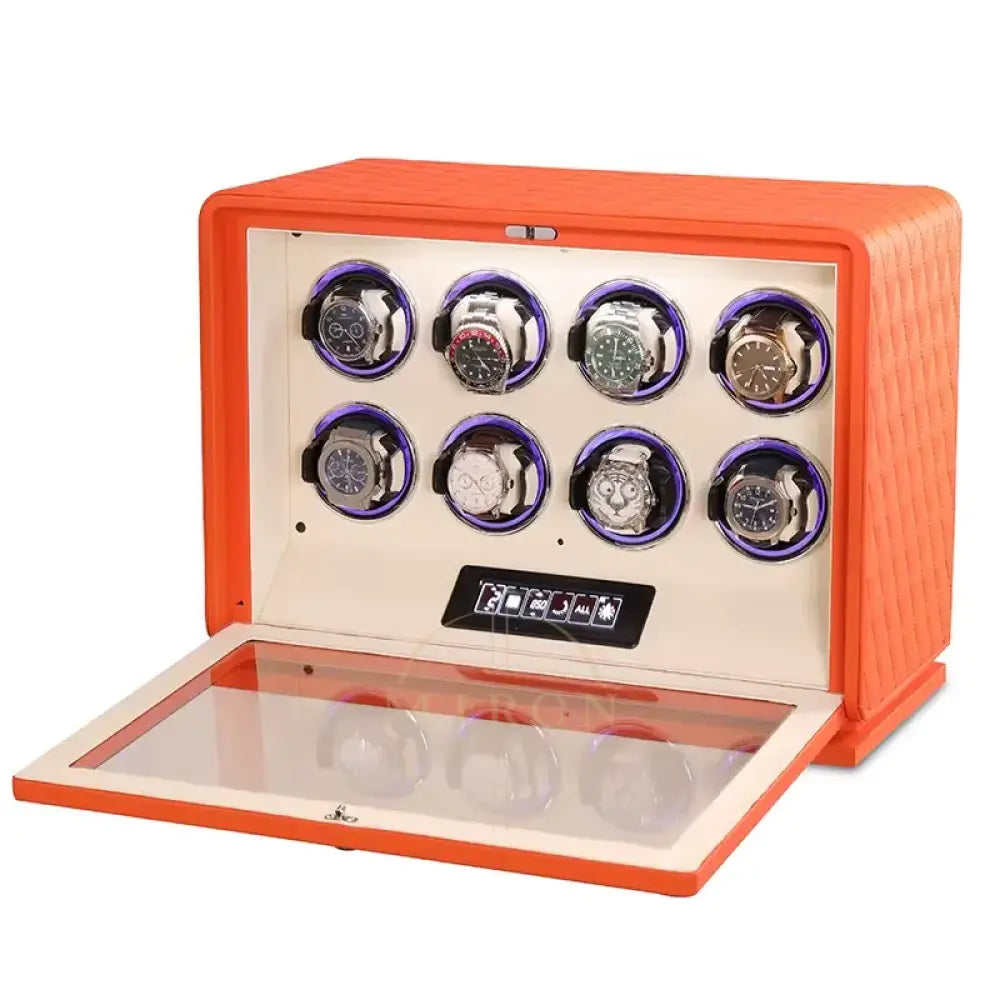 Orange watch winder with multiple watch cases on a white background