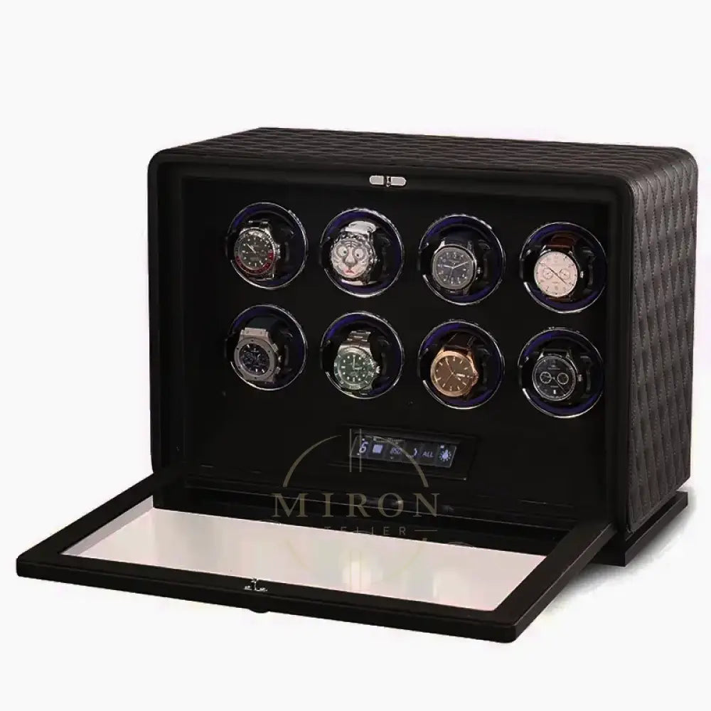Black watch winder with multiple watches on a white background
