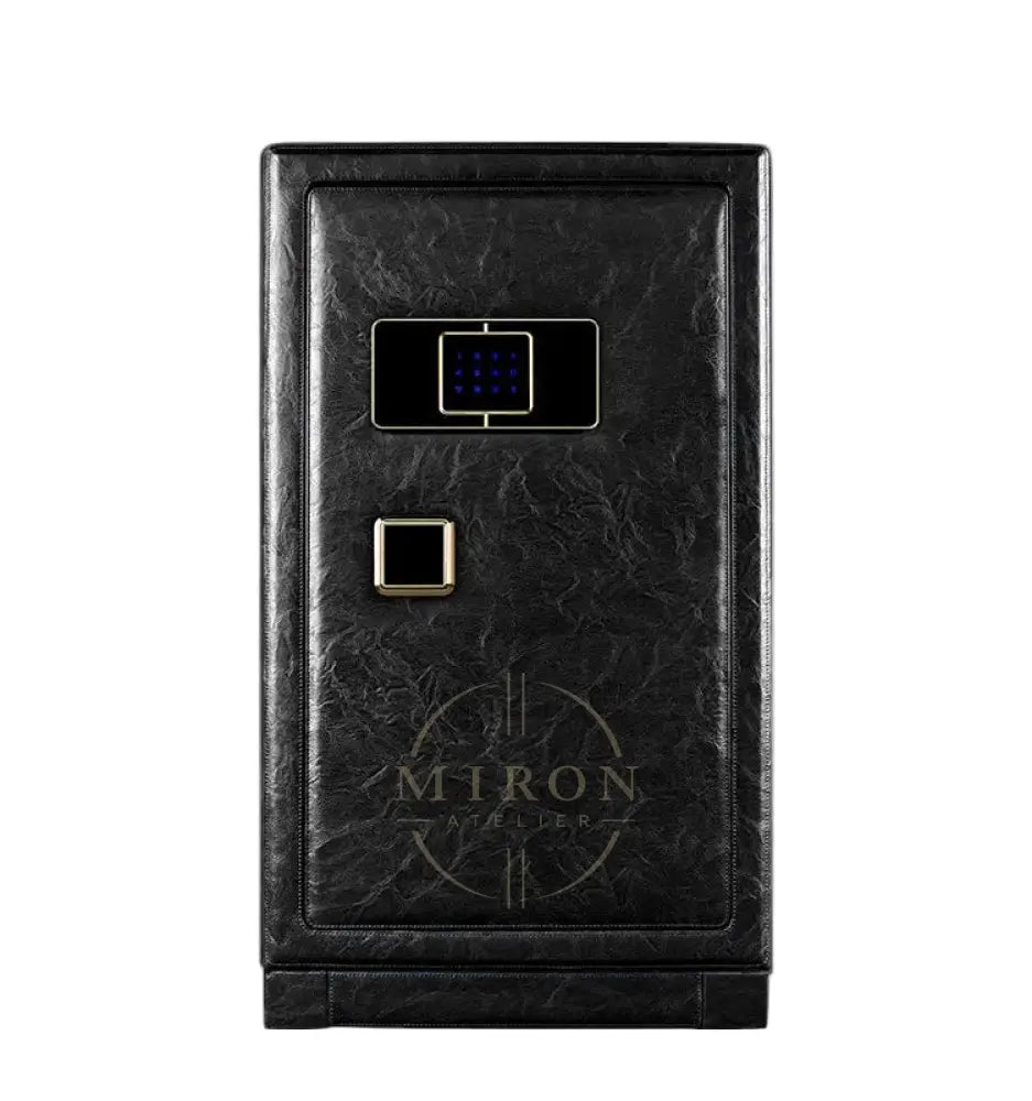 Black leather watch winder safe with gold accents on a white background