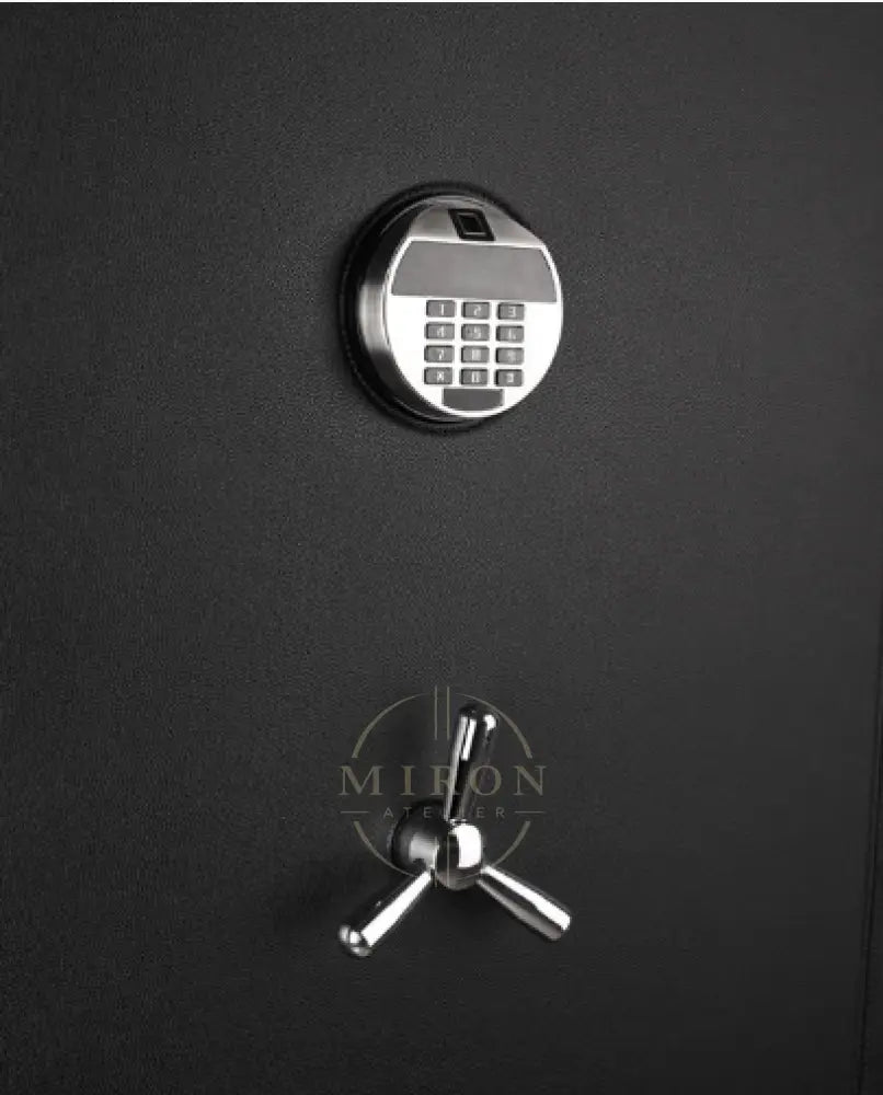 Black safe with digital keypad and traditional lock on a black background