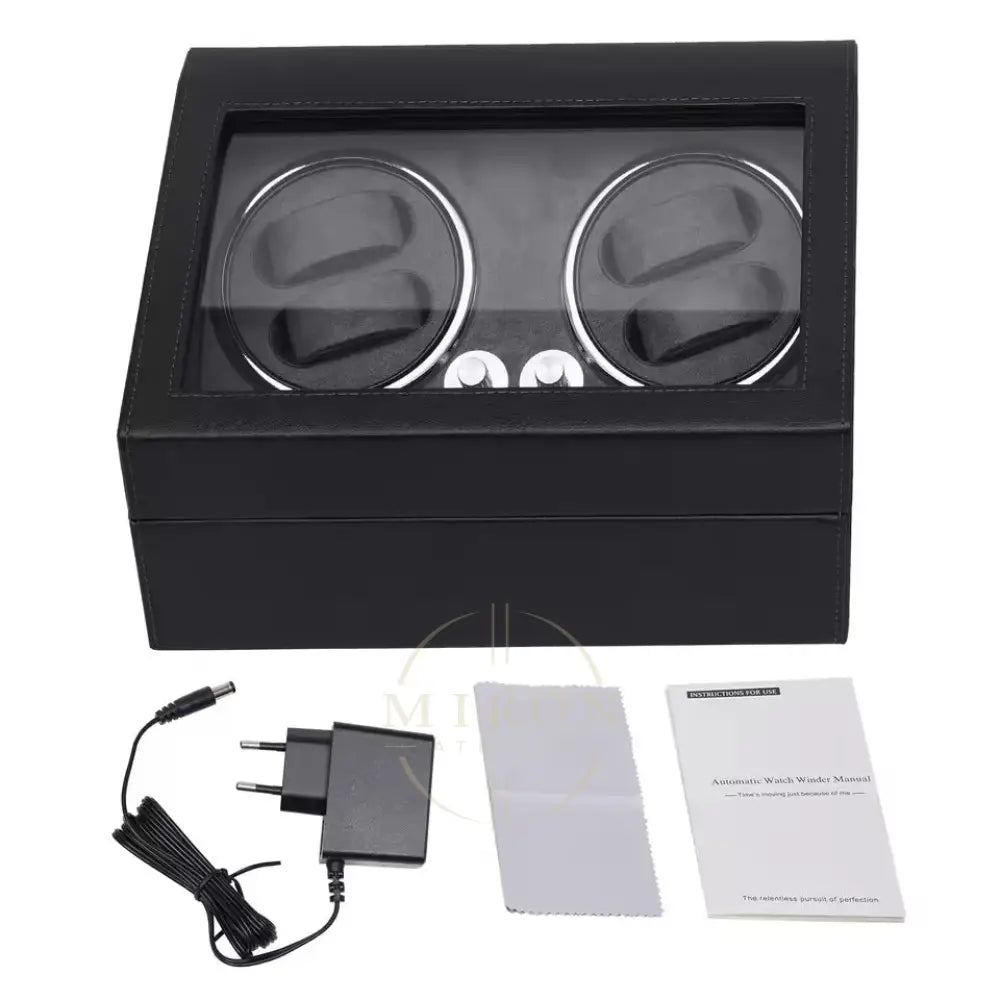 Black watch winder with accessories on a white background