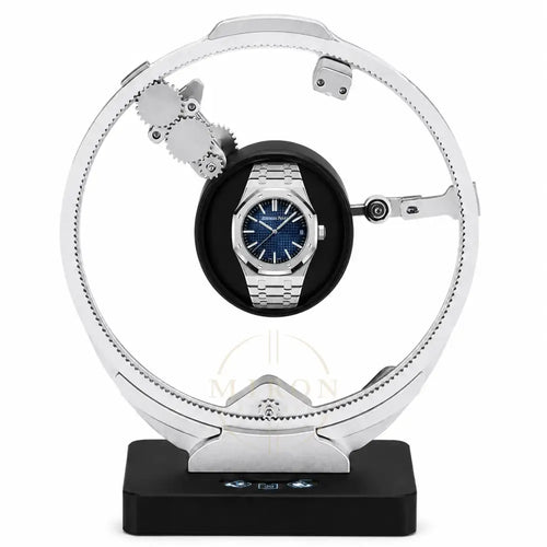 Audemars Piguet Royal Oak on a luxury watch winder stand with a white background