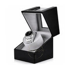 Luxury Watch in a black watch winder box and grey velour on a white background