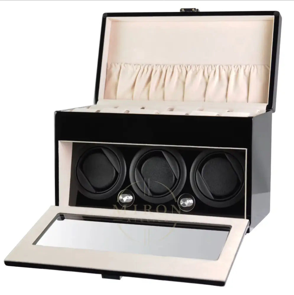 Black watch winder with open lid showing three watches inside on a white background