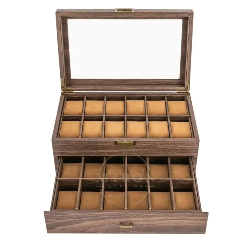 A wooden watch box with a glass lid, shown open to reveal two tiers of watch slots lined with tan velvet. The box has a dark brown wood grain finish with brass-tone metal hardware.