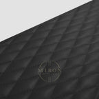 Close-up of a black quilted fabric texture of watch winder 