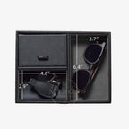 Black leather compartment box with sunglasses and cufflinks, showing dimensions on a white background.