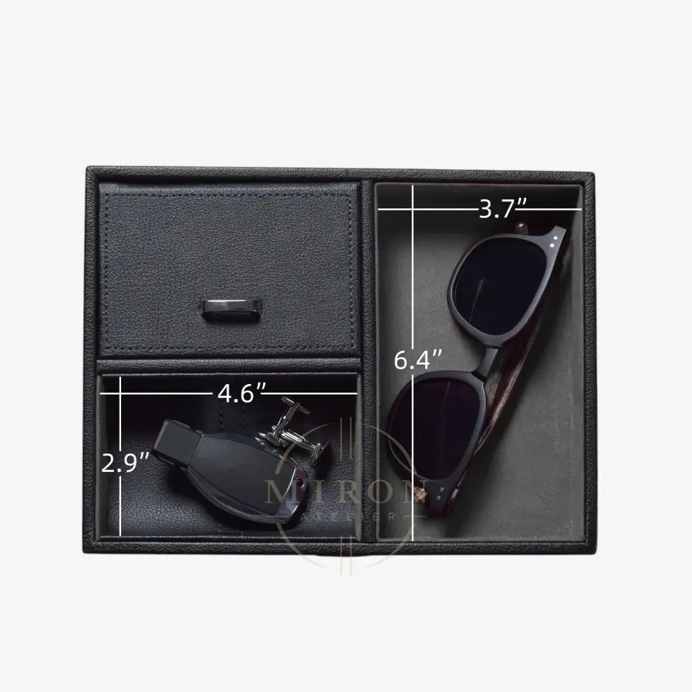 Black leather compartment box with sunglasses and cufflinks, showing dimensions on a white background.