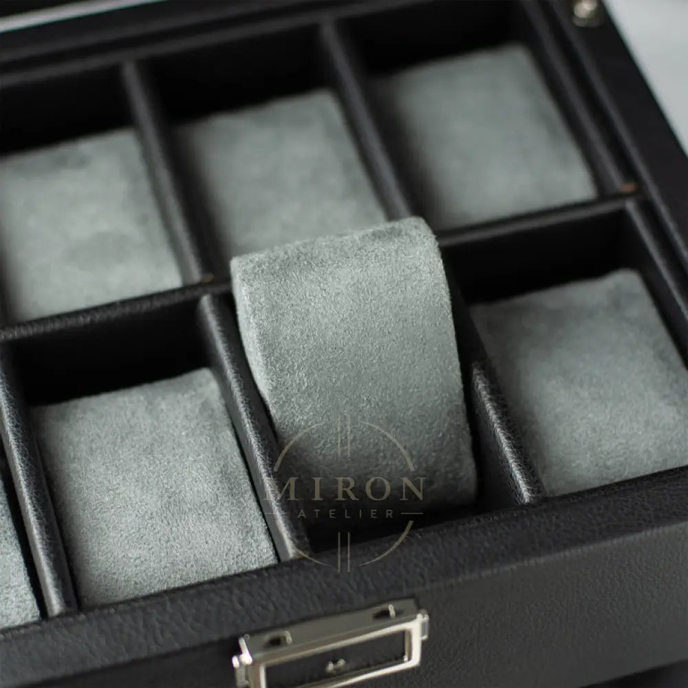 Gray ring on gray felt in a black jewelry box
