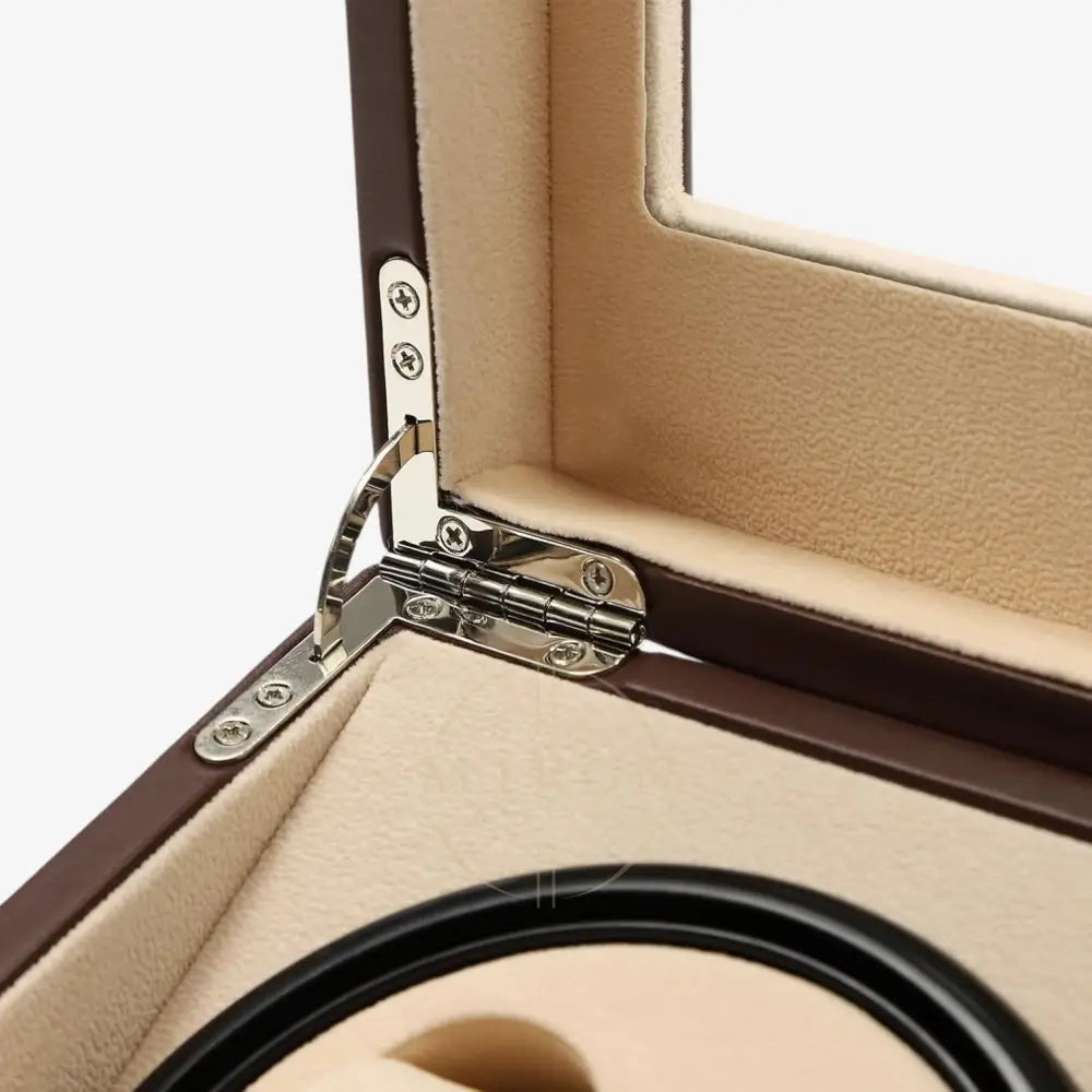 Close-up of a jewelry watch winder box with a hinge and beige interior