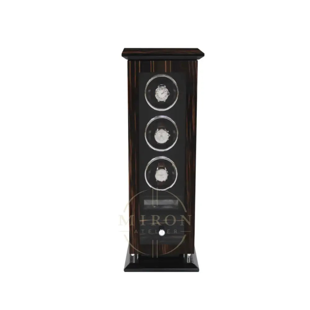 Wooden watch winder with three watches inside on a white background