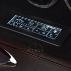 Digital display on a piece of electronic watch winder equipment with control buttons.
