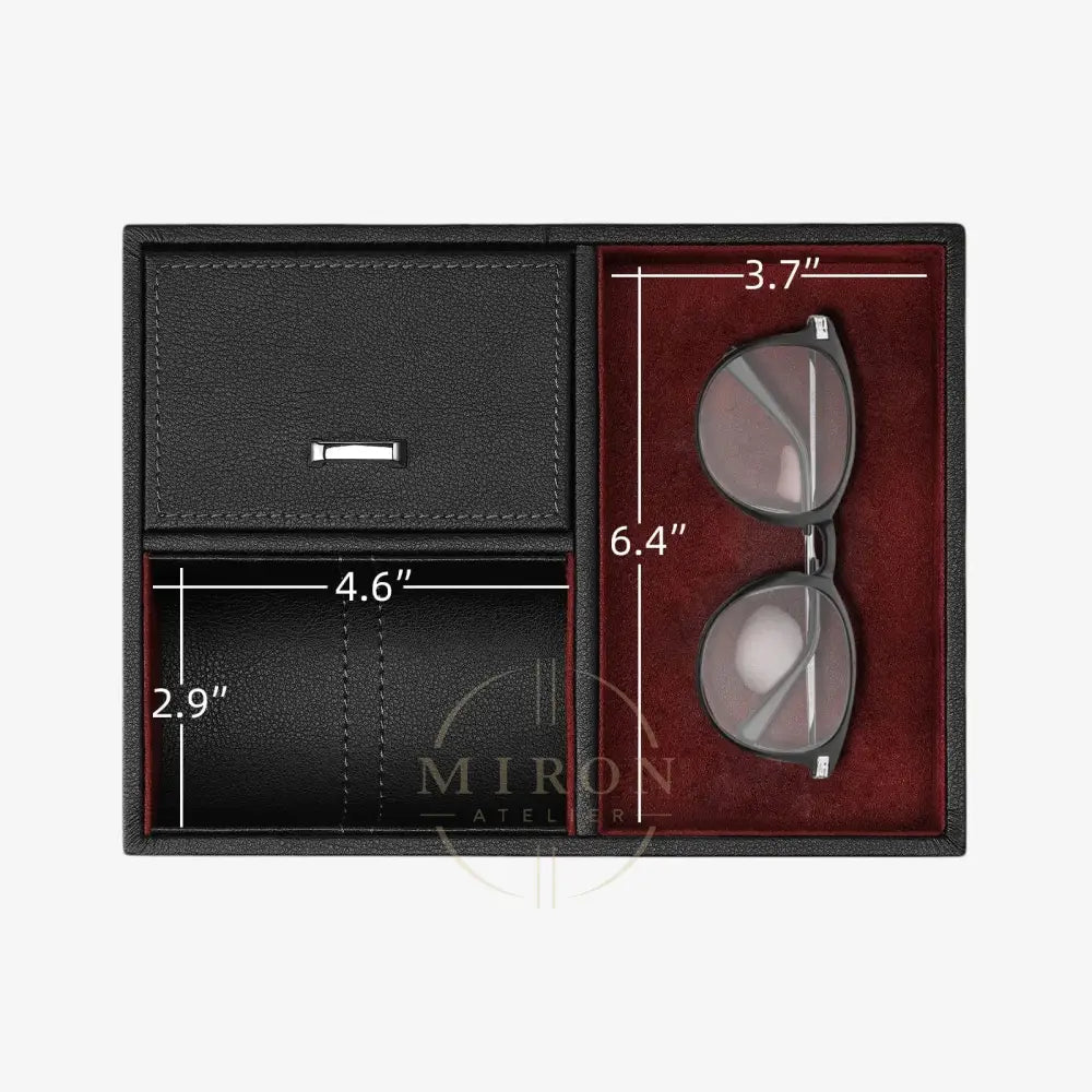 Black leather wallet and sunglasses in a box with measurements of a watch winder ompartment