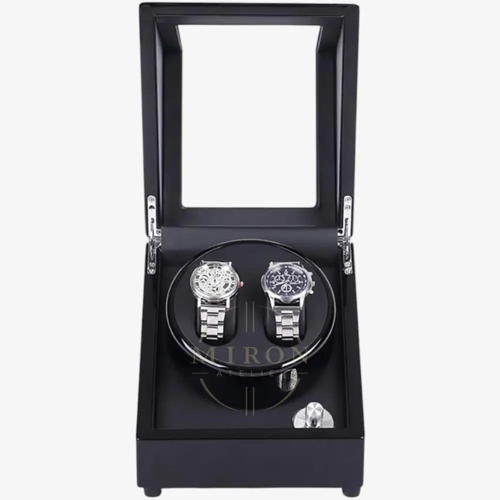 Black watch winder with two watches inside on a white background