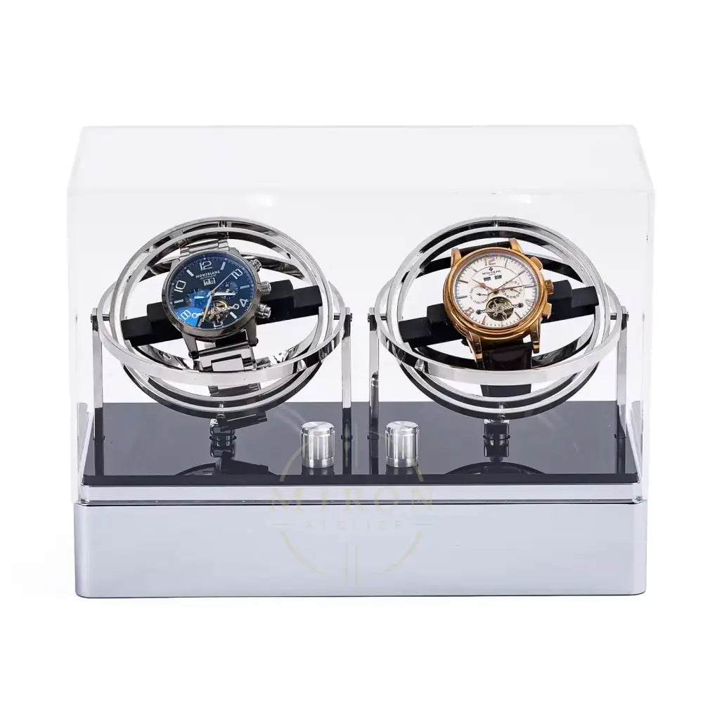 Two watches: Patek Philippe and Mont  Blanc in a Watch winder orbital. Transparent display case on a white background.