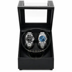Two luxury watches in a black leather watch winder box.