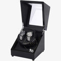 Black watch winder with two watches inside on a white background