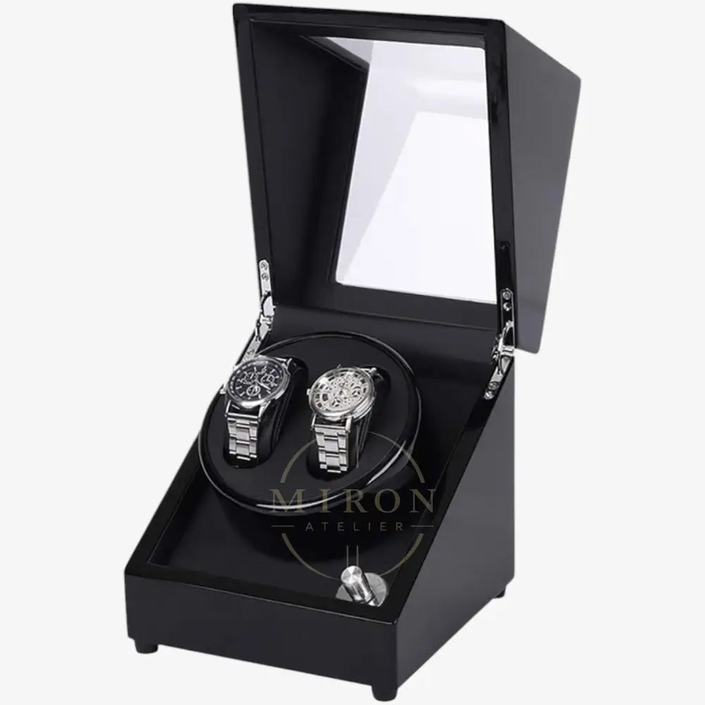Black watch winder with two watches inside on a white background