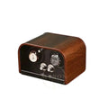 Wooden watch winder with two watches on a white background