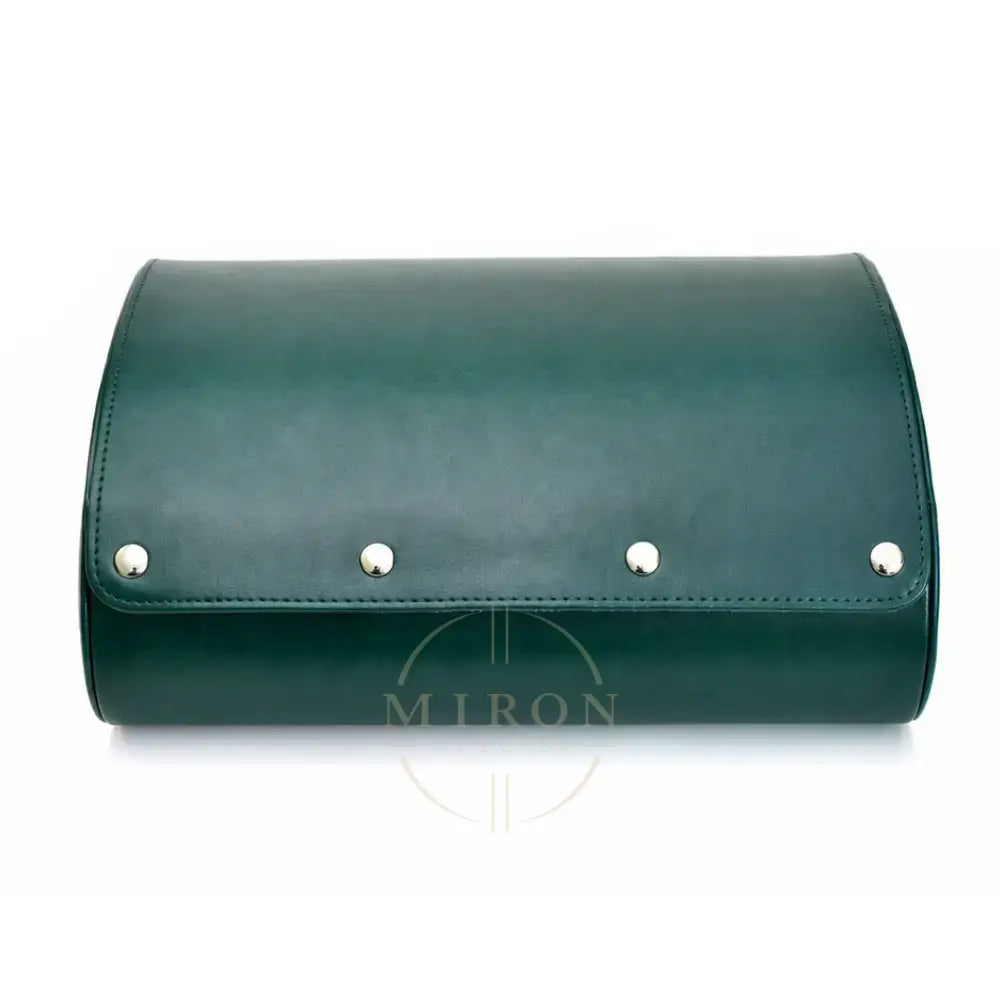 A dark green leather watch roll with a curved top, featuring four silver metal studs along the front flap, set against a plain white background.