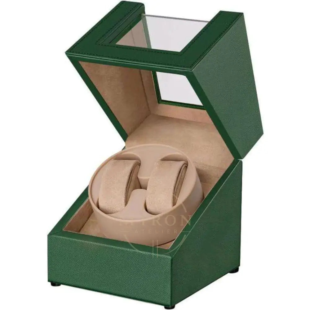 Green watch winder box with a beige interior holding two watches on a white background