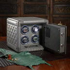grey leather watch winder with four rotating watches on a wooden surface.