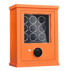 Orange watch winder with digital display on a white background