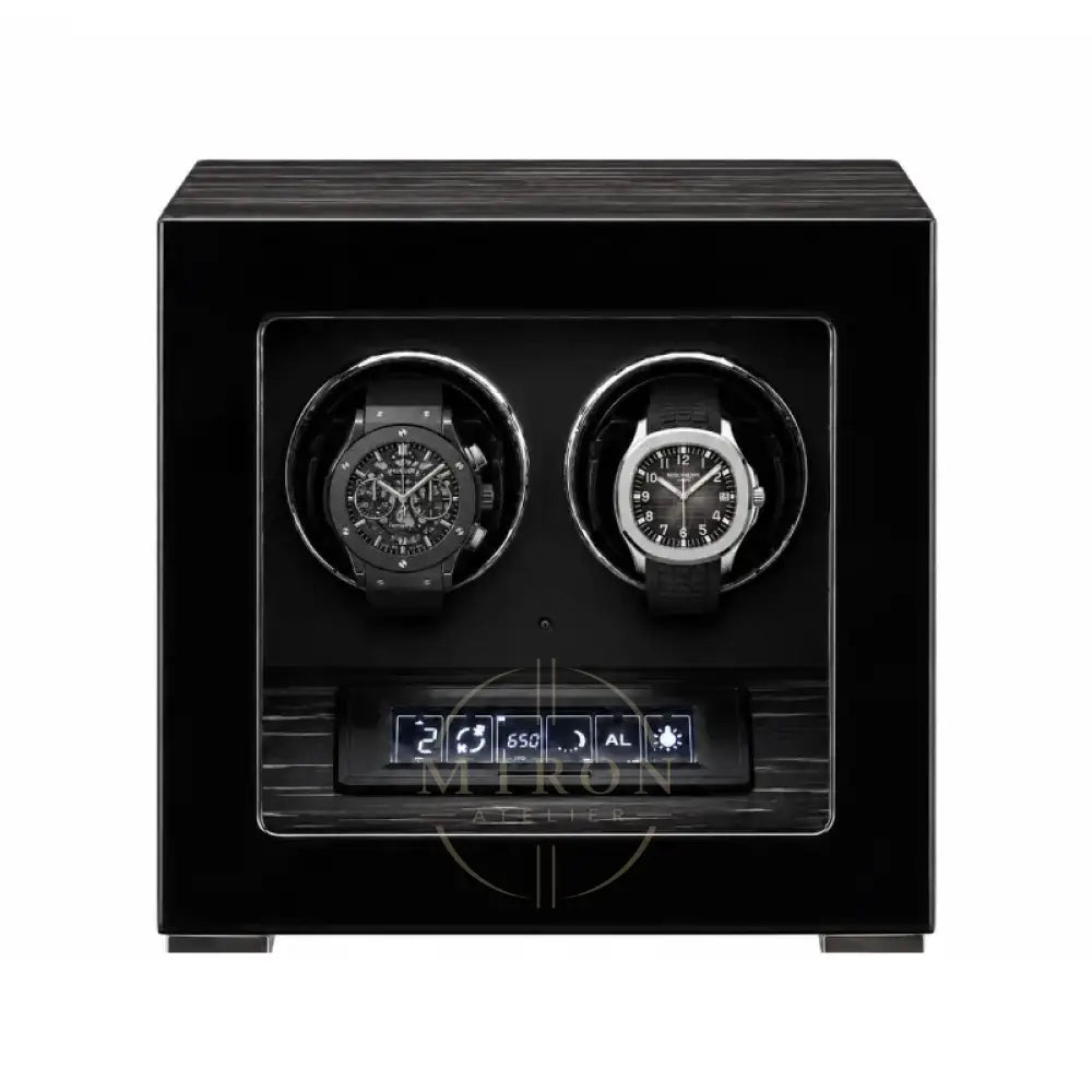 Black watch winder with two luxury watches inside : Patek Philippe and Audemars Piguet.