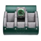 A green leather watch roll stand with a gray velvet interior, shown open and holding a Rolex Hulk watch with a green dial and bezel.