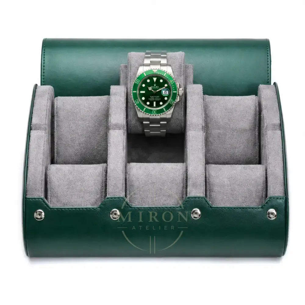 A green leather watch roll stand with a gray velvet interior, shown open and holding a Rolex Hulk watch with a green dial and bezel.