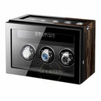 Watch winder with three watches on a white background