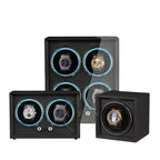 Set of luxury watch winders with watches inside on a white background