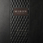 Black textured surface with a 'Miron Atelier' label