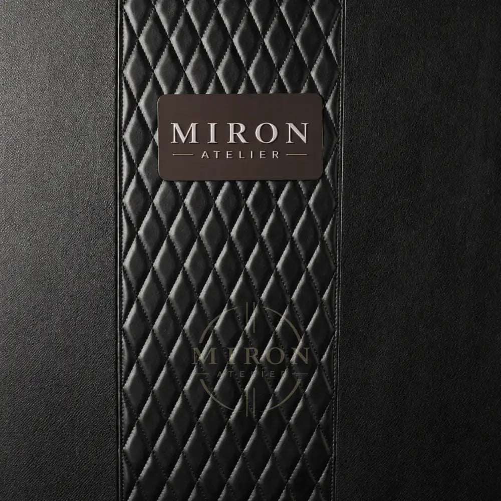 Black textured surface with a 'Miron Atelier' label