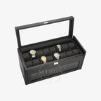 Black watch winder display case with multiple watches on a white background