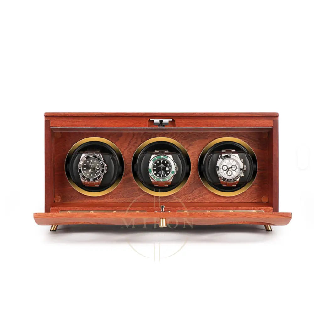 Wooden watch winder with three luxury watches on a white background
