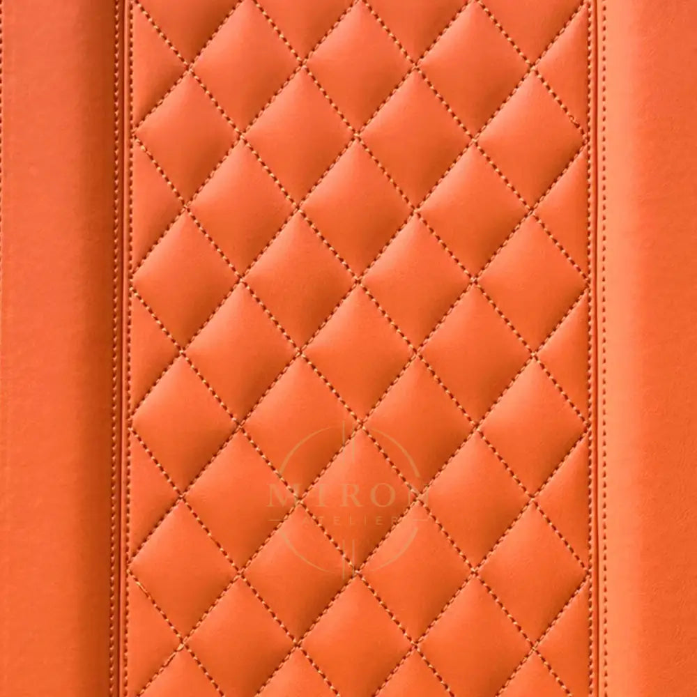 Close-up of orange quilted leather texture
