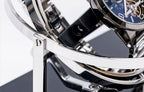 Close-up of a luxury watch Mont Blanc with intricate design and blue face. Display on a luxury orbital watch winder.