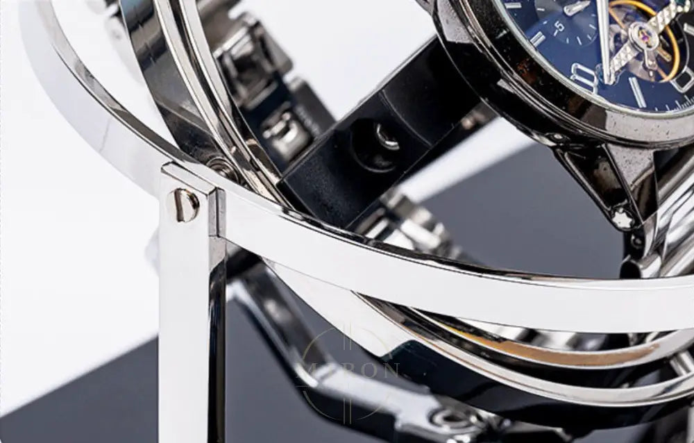 Close-up of a luxury watch Mont Blanc with intricate design and blue face. Display on a luxury orbital watch winder.