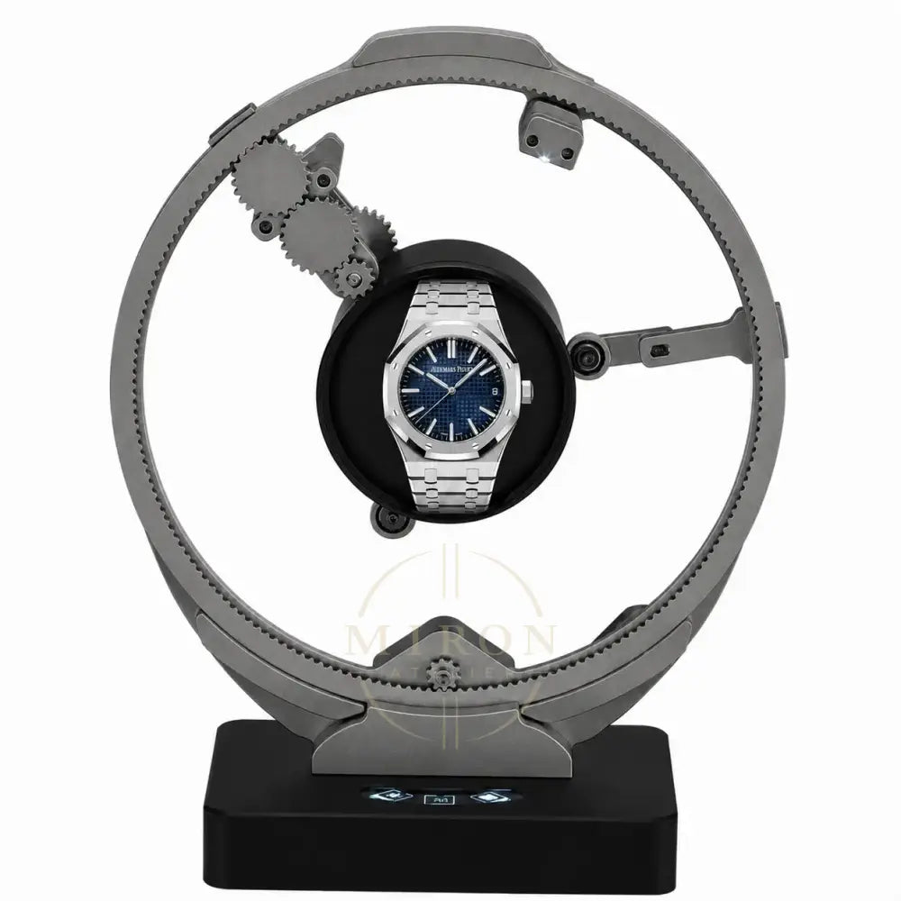Audemars Piguet on a rotating luxury watch winder stand with a white background