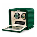 Green watch winder with two rolex inside on a white background