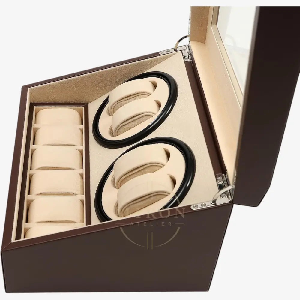 Set of beige hair ties with black accents in a brown watch winder box on a white background