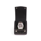 Silver watch in a black leather display case on a white background