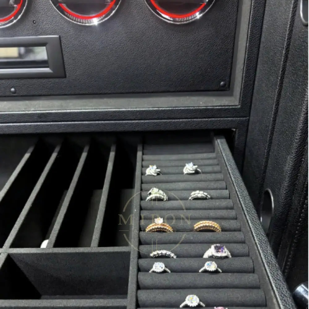 Car console with a jewelry organizer displaying rings.