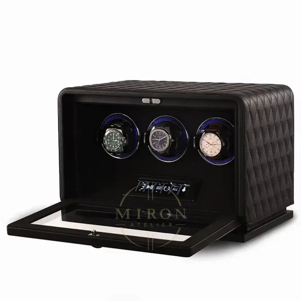 Black watch winder with three watches on a white background