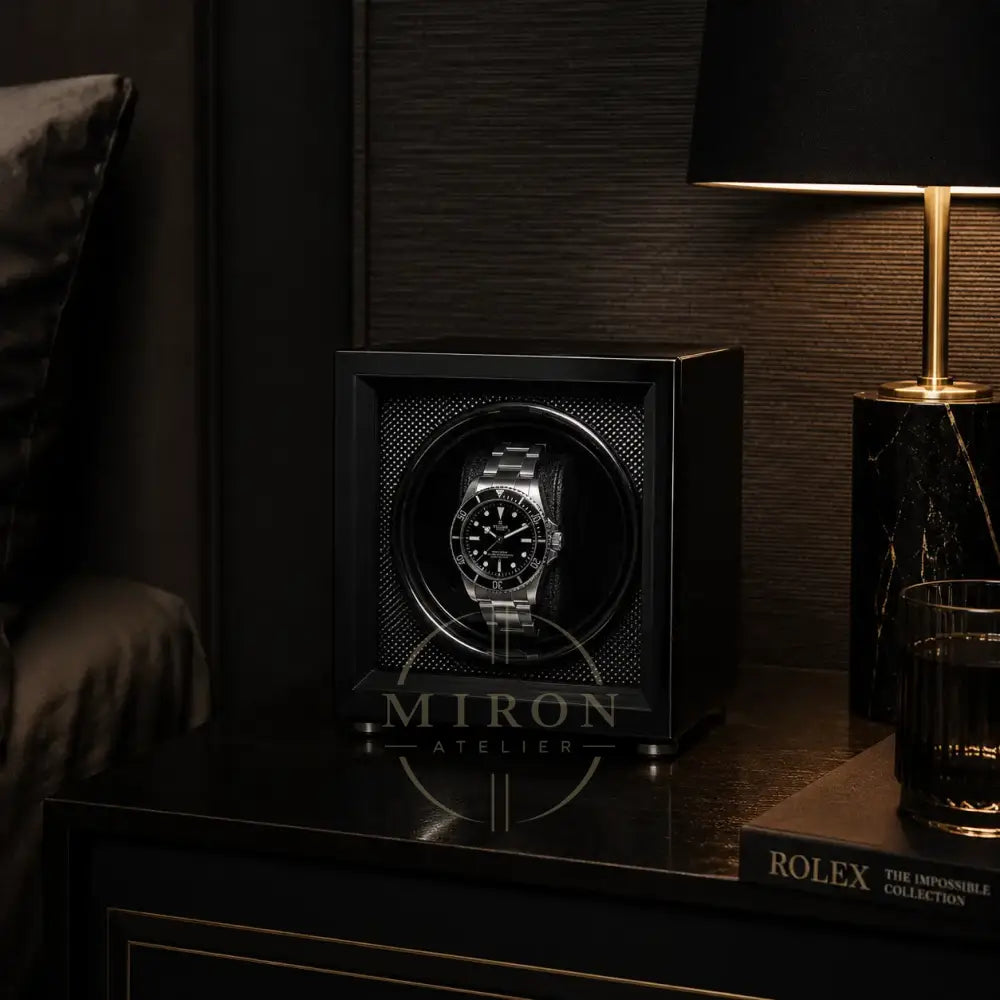 Tudor Black Watch in a watch winder on a night stand