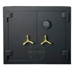 Black safe with gold handles on a white background